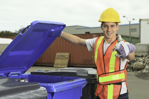 Charity volunteers collecting reusable furniture from a commercial loading bay